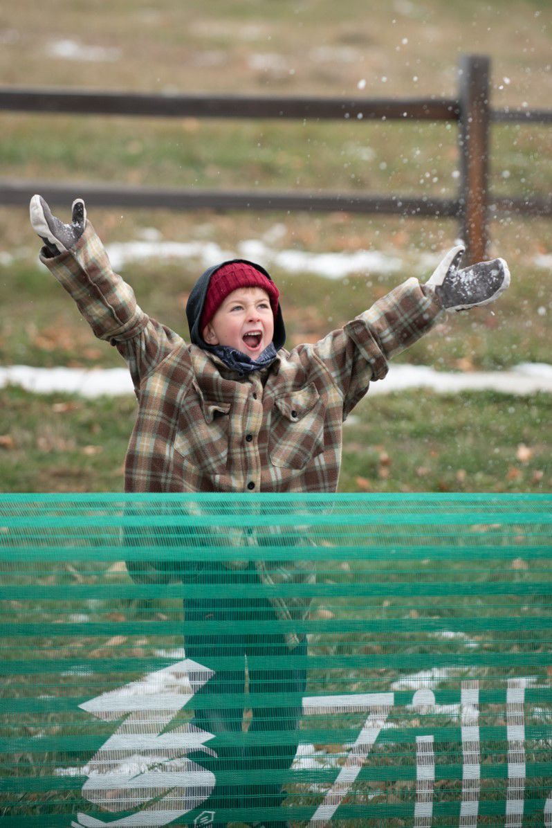 Roman Lytle tosses snow